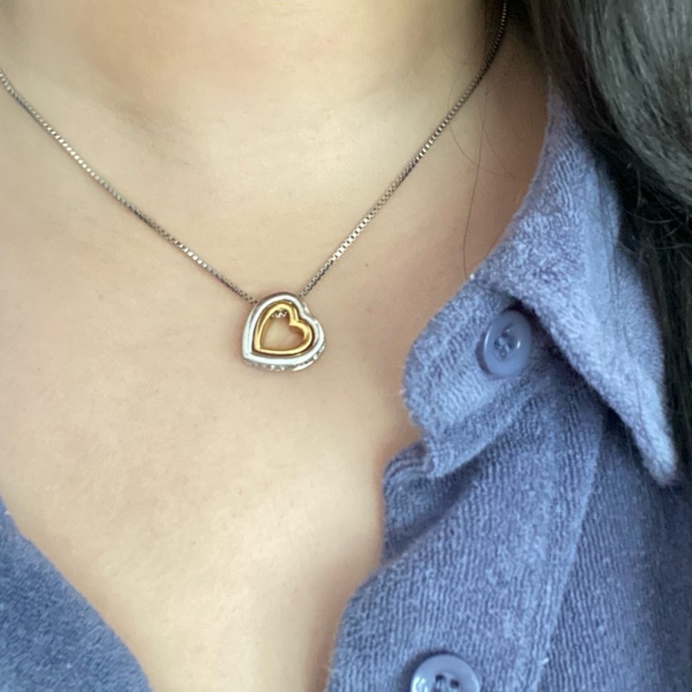 Two toned Gold and Silver heart necklace with diamonds.